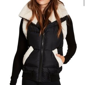 SAM by New York matte black Billie cream shearling lined puffer vest from Saks.